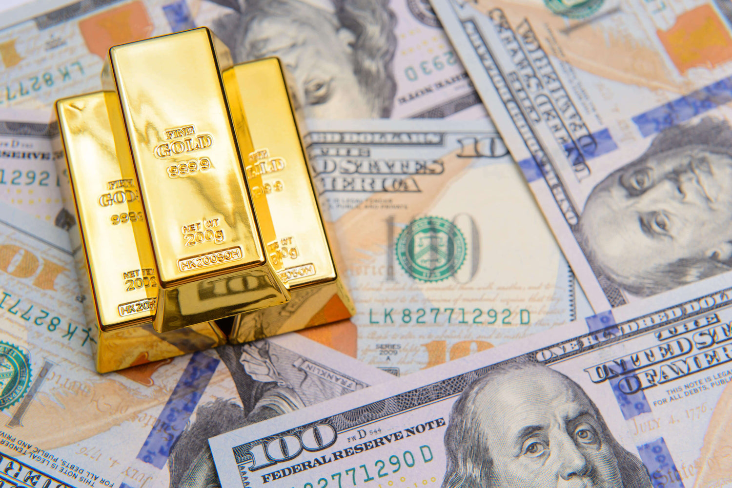 Gold bars and USD money